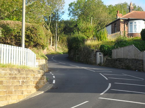 The sharp left leading to the sharp right, the top is about 100 yards after this.